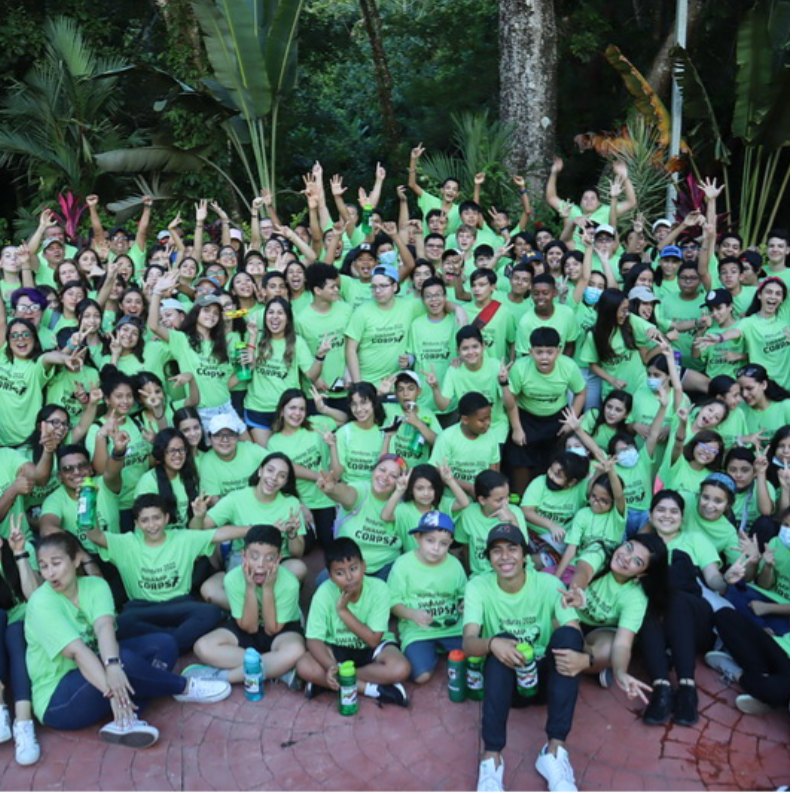 A large camp group in green Swamp Corps shirts
