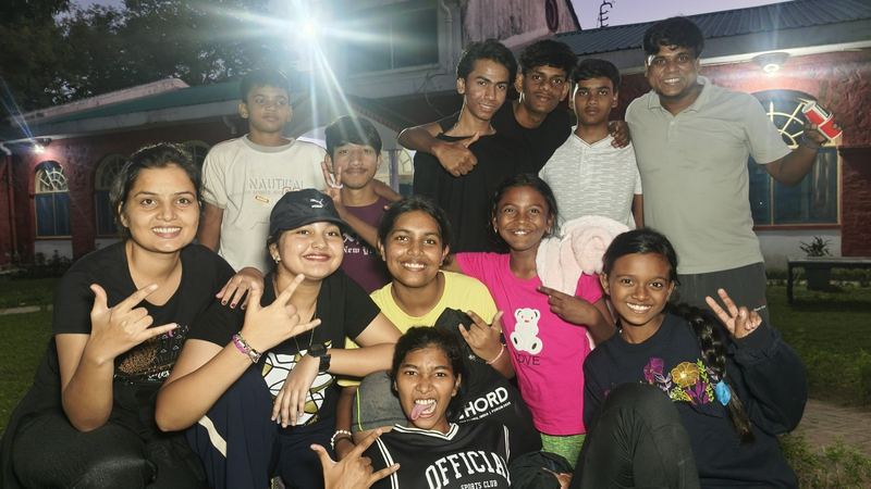 Campers grinning and throwing hand signs at Swamp Camp India