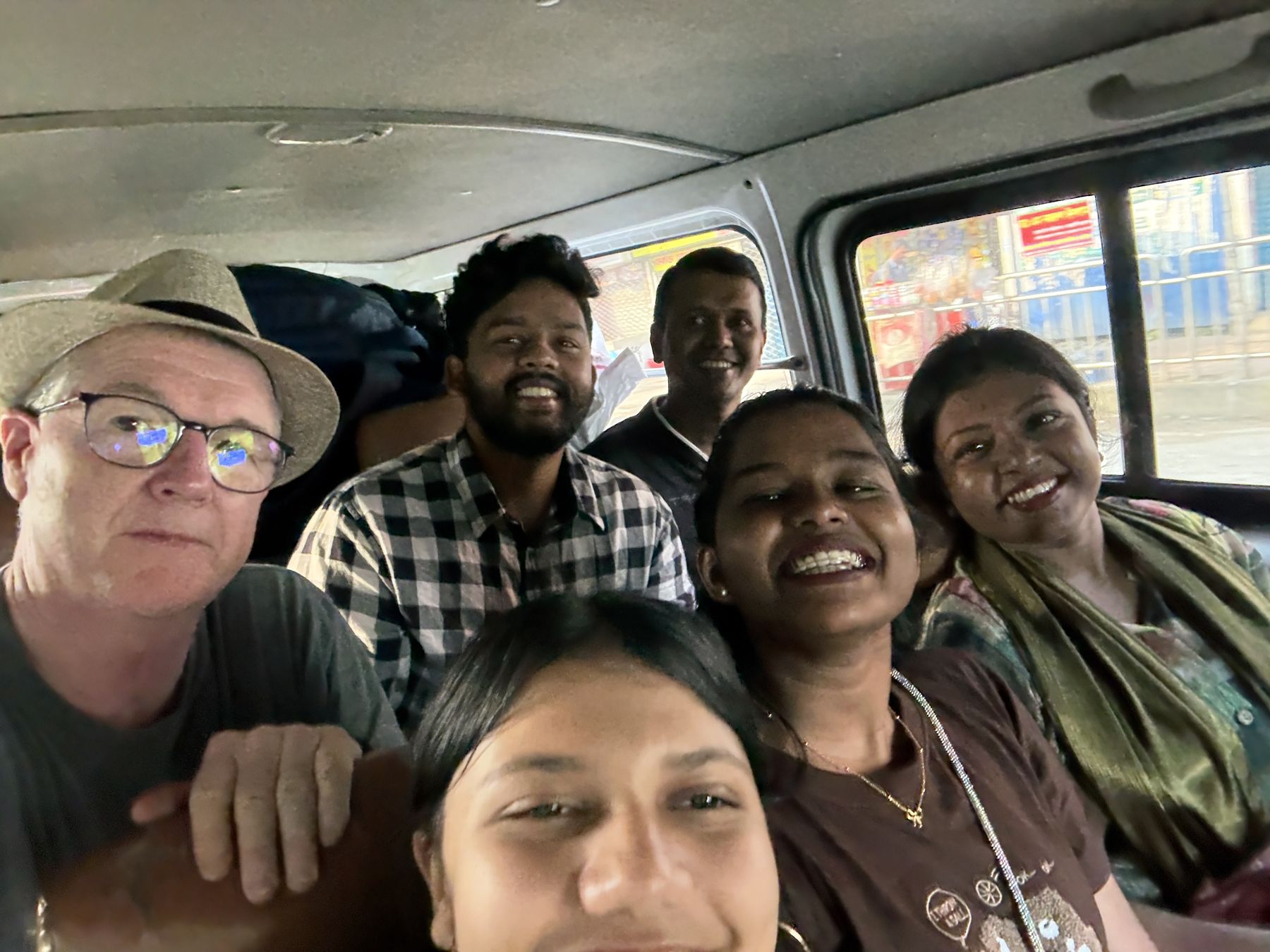 A team selfie in the van on the road in Bangladesh